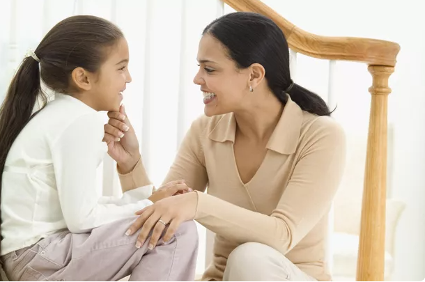 mum and daughter smiling 